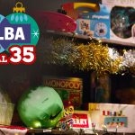 Shelves full of toys and tinsel with the Toy Appeal 35 years logo in one corner.